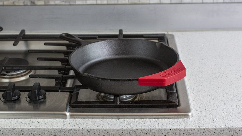 Lodge Silicone Assist Handle Holder - Dishwasher Safe Hot Handle Holder Designed for Traditional Lodge Cast Iron Dual Handle Products - Reusable Heat Protection Up to 450° - Red
