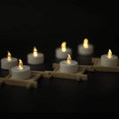 YIWER Flameless Tea Lights Candles - Realistic LED Flickering Operated Tea Lights Battery Tealights Long Lasting Electric Fake Candles in Warm White 200pcs Decoration for Party and Gifts Ideas