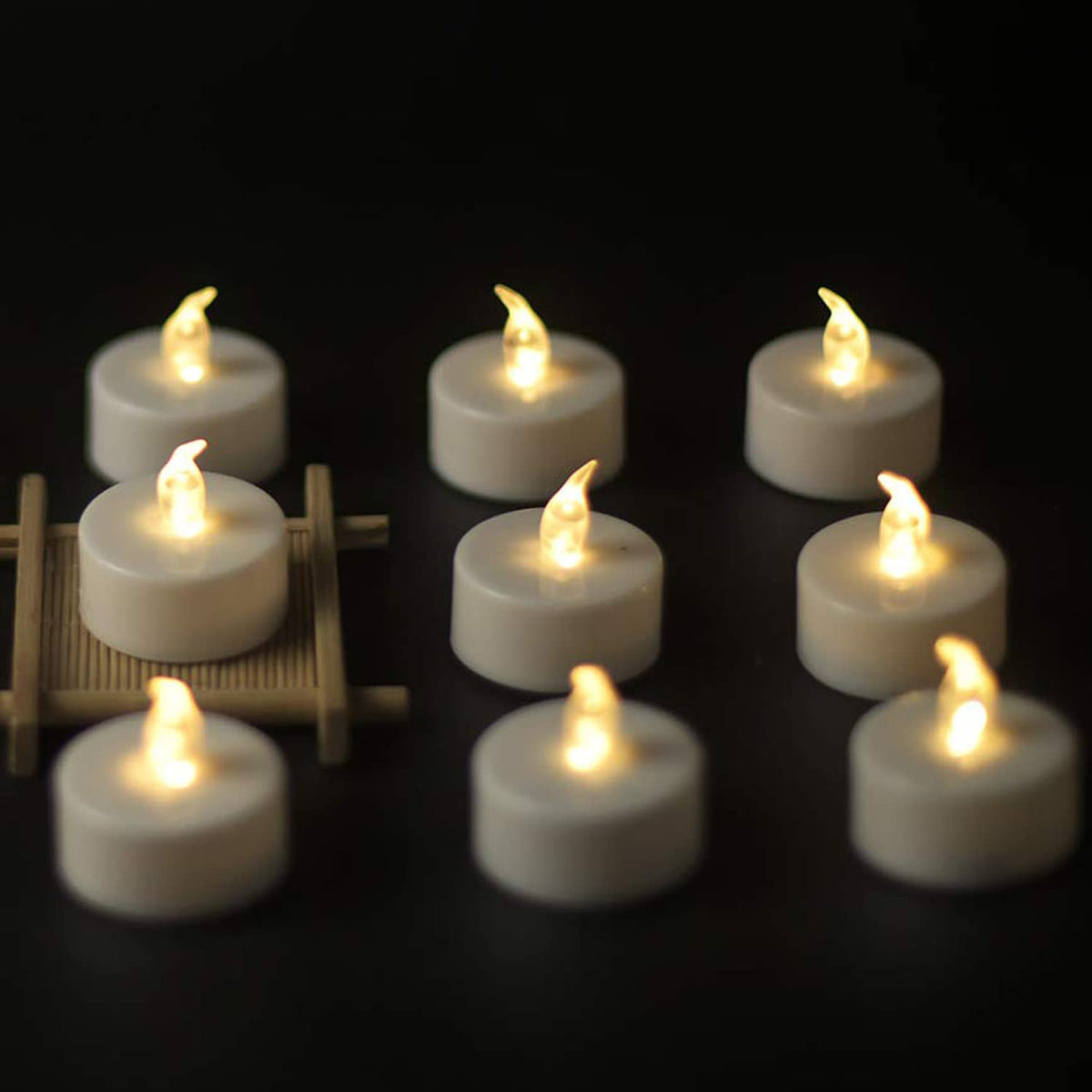 YIWER Flameless Tea Lights Candles - Realistic LED Flickering Operated Tea Lights Battery Tealights Long Lasting Electric Fake Candles in Warm White 200pcs Decoration for Party and Gifts Ideas