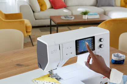 Bernette B77 Computerized Sewing Machine | Heavy Duty, Quilting & Embroidery Kit with Extension Table, Presser Feet, Bobbins, Thread Spools, Needles, Rotary Cutter, LCD Display & $200 Bonus Bundle