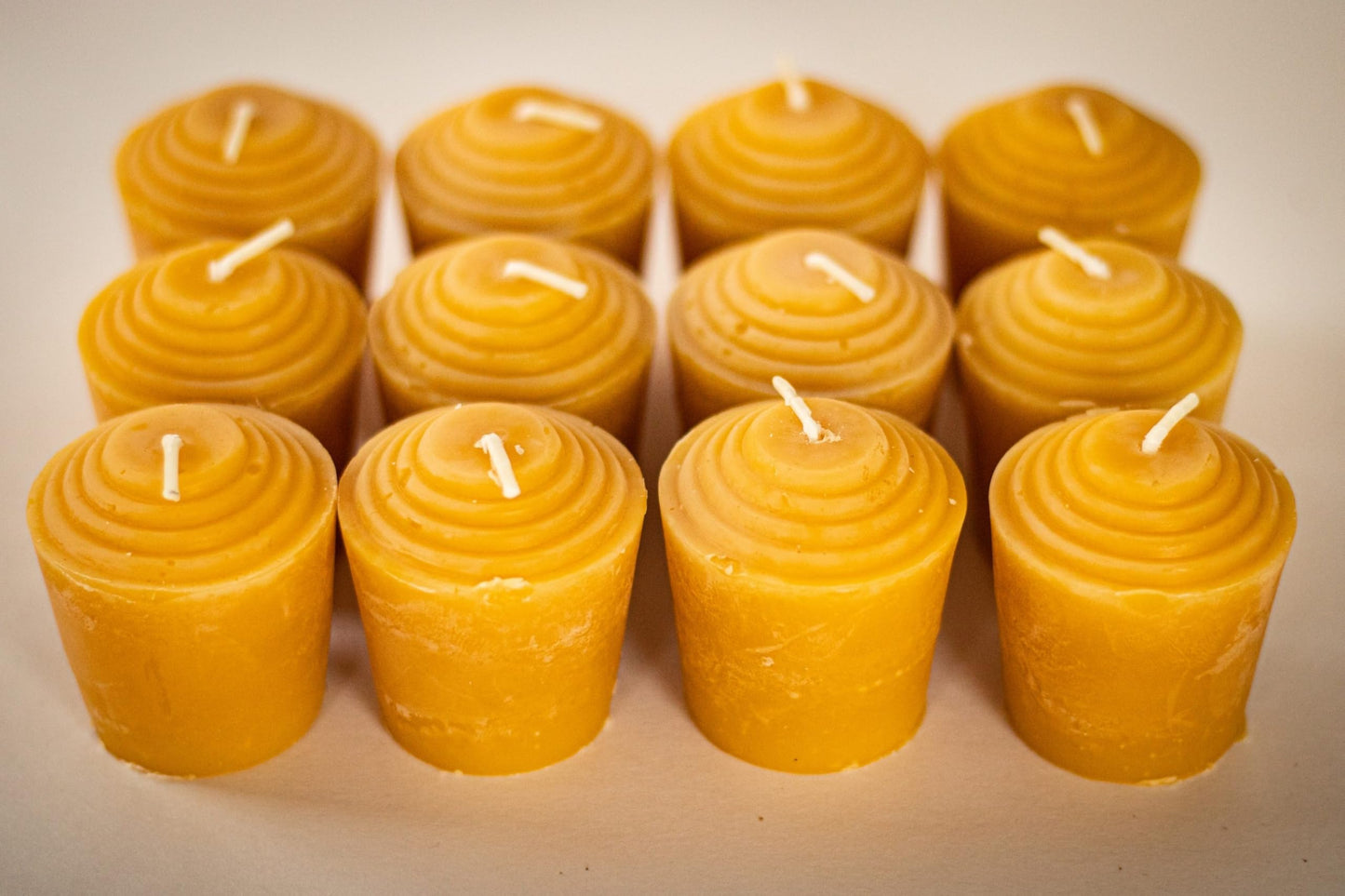 100% Pure Beeswax Votive Candles - USA-Sourced Handmade Votives for Home, Christmas, and Advent, Smokeless Unscented 12 Candle Set with Natural Honey Aroma, 1.96 x 1.77 Inches, by BeeTheLight
