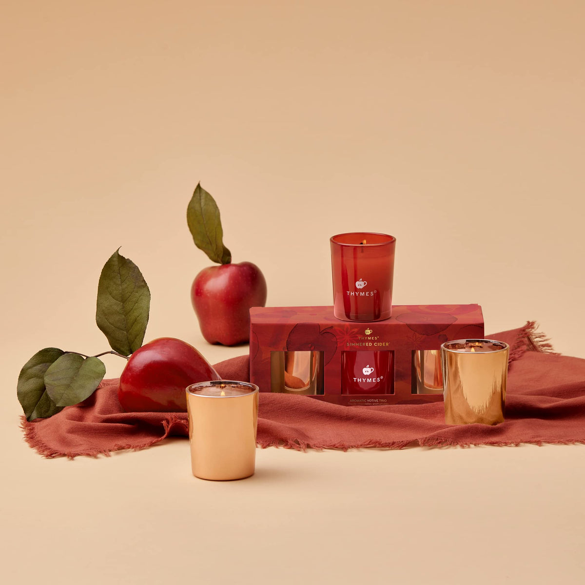 Thymes Aromatic Votive Trio – Set of Three Votive Candles – Luxury Home Fragrance – Scented Candles with Notes of Freshly Pressed Apple, Clove, & Cardamom – Red & Rose Gold (Simmered Cider, 2 oz Each)