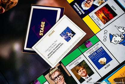 Monopoly: Elton John Play as Iconic Headgear Star Glasses &amp More Collect Legendary Career Moments Like Knighthood &amp Farewell Tour Officially Licensed Elton John Board Game