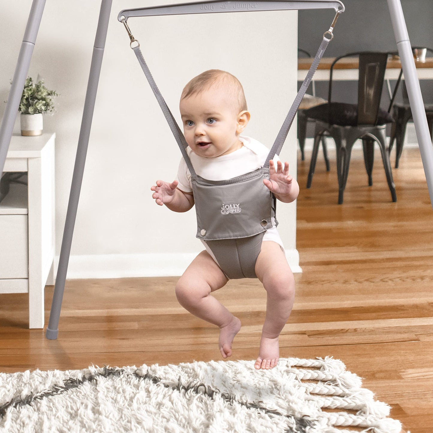 Jolly Jumper *Elite* Safari Print Saddle - The Original Jolly Jumper with Stand. Trusted by Parents to Provide Fun for Babies and to Create Cherished Memories for Families for Over 75 Years.