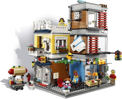 LEGO Creator 3 in 1 Townhouse Pet Shop &amp Café 31097 Toy Store Building Set with Bank Town Playset with a Toy Tram Animal Figures and Minifigures (969 Pieces)