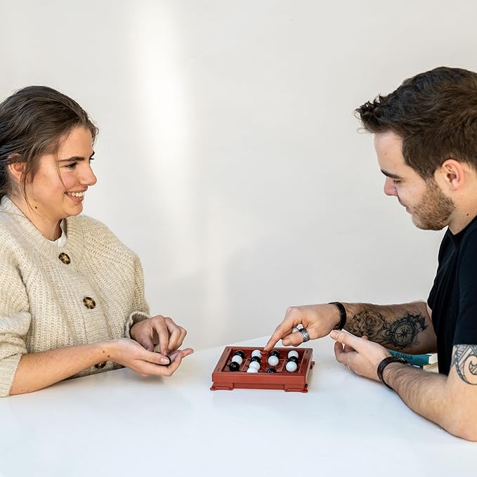 Orbito from Flex IQ 2 Player Strategy Games for Family Gatherings Great for Kids Games Includes 1 Game Board with Orbito Button 8 White Marbles and 8 Black Marbles