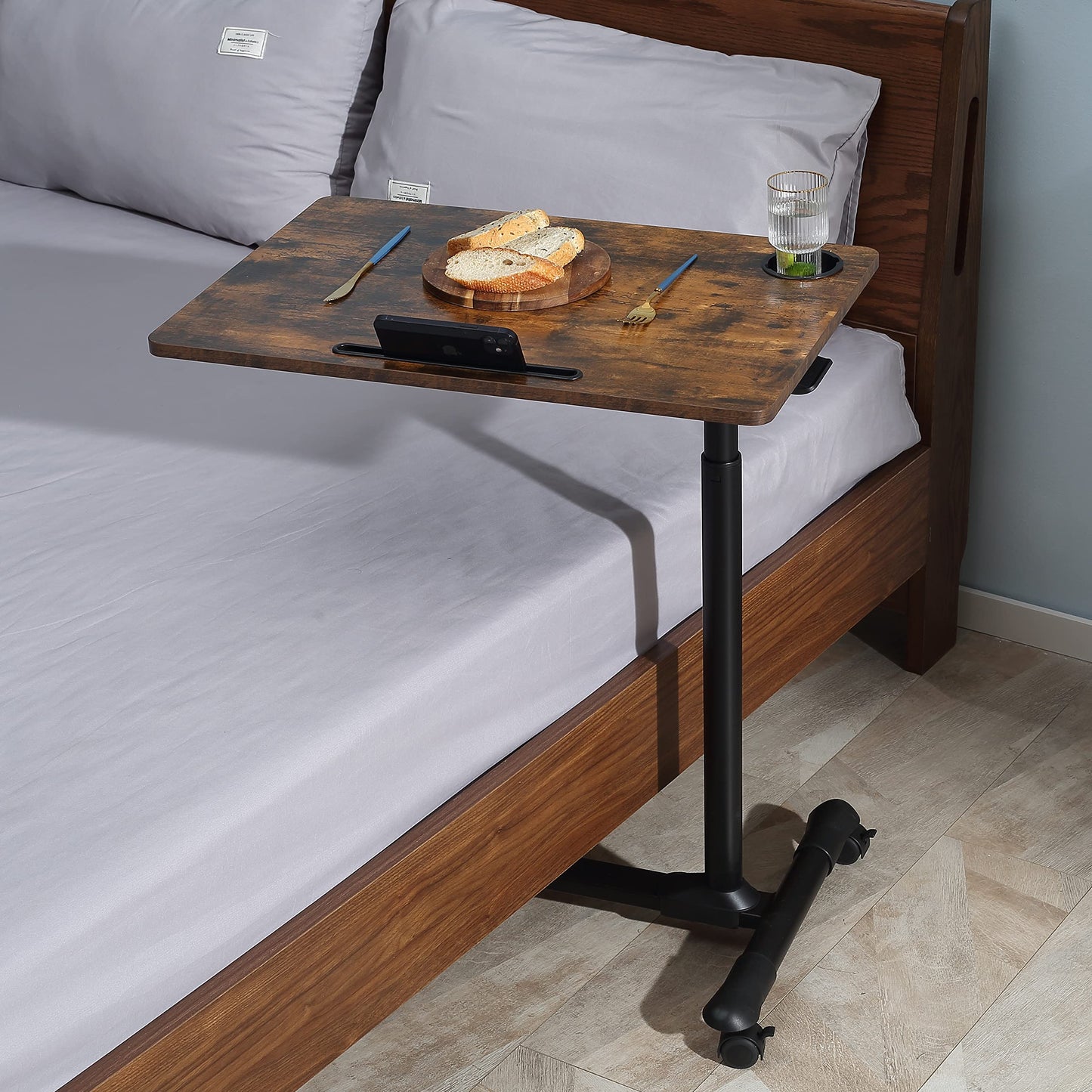 ETHU Overbed Table with Hydraulic Lift, 27.1-34.2 Inch Height Adjustable Bed Table with Lockable Casters - Wood Grain Tabletop with Cup Holder & Charging Slot, 22lbs Capacity Rolling Bedside Desk