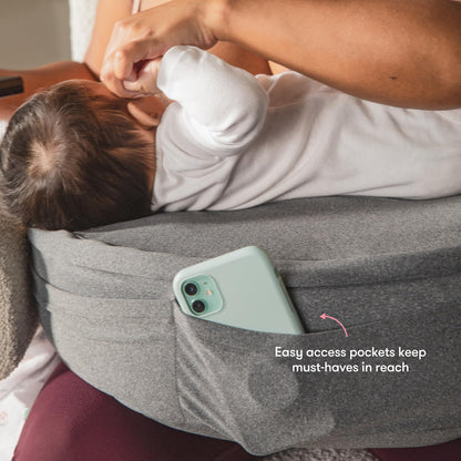 Frida Mom Nursing Pillow, Adjustable Breastfeeding Pillow for Mom & Baby Comfort with Back Support, Customizable Wrap Around Waist Strap, and Pockets for Heat Relief