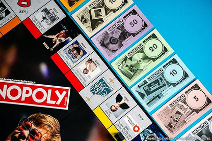 Monopoly: Elton John Play as Iconic Headgear Star Glasses &amp More Collect Legendary Career Moments Like Knighthood &amp Farewell Tour Officially Licensed Elton John Board Game