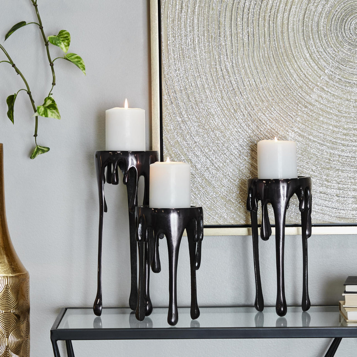 CosmoLiving by Cosmopolitan Aluminum Metal Decorative Candle Holder Pillar Candle Stand with Dripping Melting Designed Legs, Set of 3 Candlestick Holder 12", 10", 8"H, Black